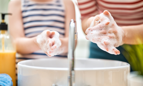 Parent and Child Washing Their Hands